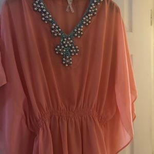 Oversized blouse with pearl accent